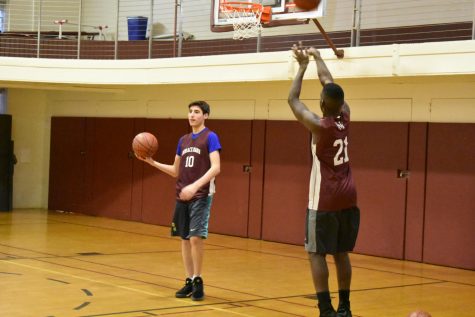 Boys’ Varsity Basketball falls to Regis in a high-scoring match