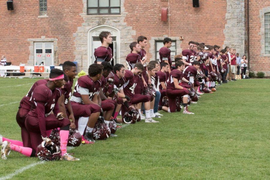 Football players kneel during national anthem