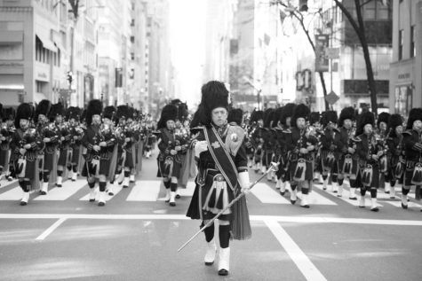 Security department members play in NYPD Drums and Pipes band