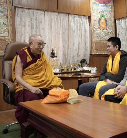 His Holiness the Dalai Lama and Matthew Wu wearing a yellow Hada, given to him by the Dalai Lama as a blessing.